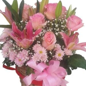 Lilies mixed with Roses & Chrysanthamums in a basket, close up