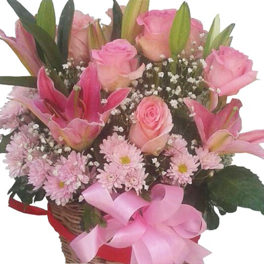 Lilies mixed with Roses & Chrysanthamums in a basket, close up