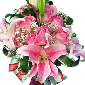 Lilies and pink Roses in a vase, close up