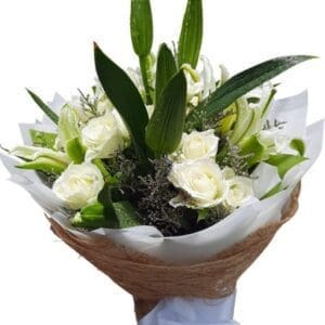 White Roses and Lilies in a bouquet close up
