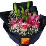 Lilies & Roses Black Wrap Bouquet close