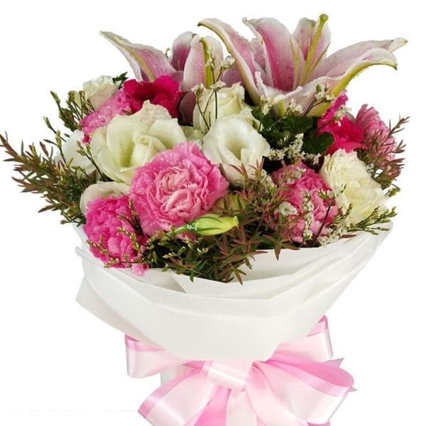 A mixed Bouquet of seasonal blooms in pink and white close up